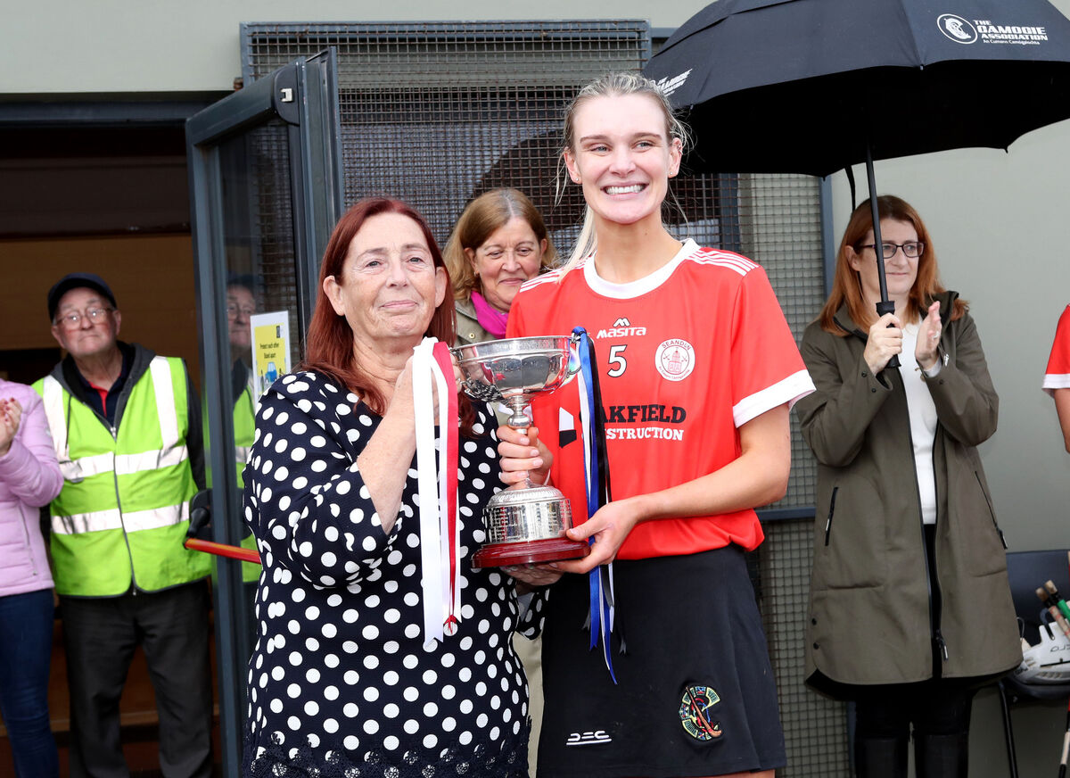  Mairead Donovan, chairperson Cork Camogie, presents the cup to Susan-Kate Brosnan, Seandún captain. Picture: Jim Coughlan.