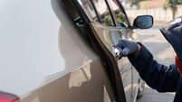 Male thief tries to steal a car. Car theft concept