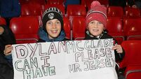 Cork city footballer gifts boots to young fan