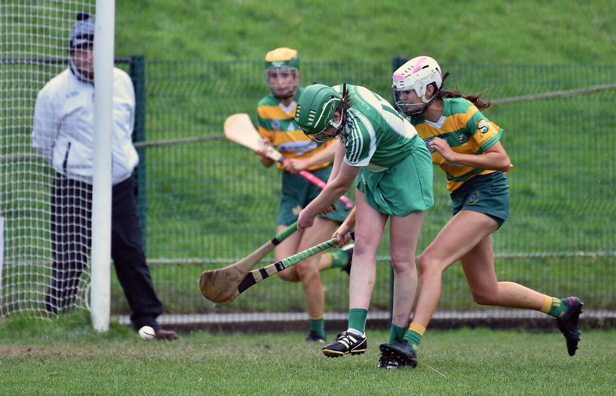  Cliona Healy, Aghabullogue, fires home her goal past Blackrock defenders Kate O'Brien and Anna Lucey. Picture: Dan Linehan