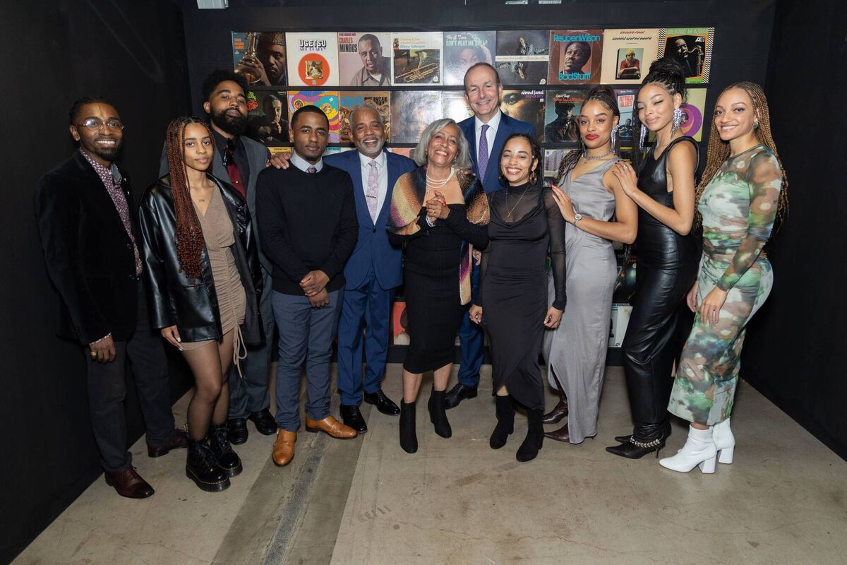 An Taoiseach Micheál Martin with the family of renowded music photography Chuck Stewart at the opening night of the Cork Guinness Jazz Festival in St Peters. Picture: Darragh Kane