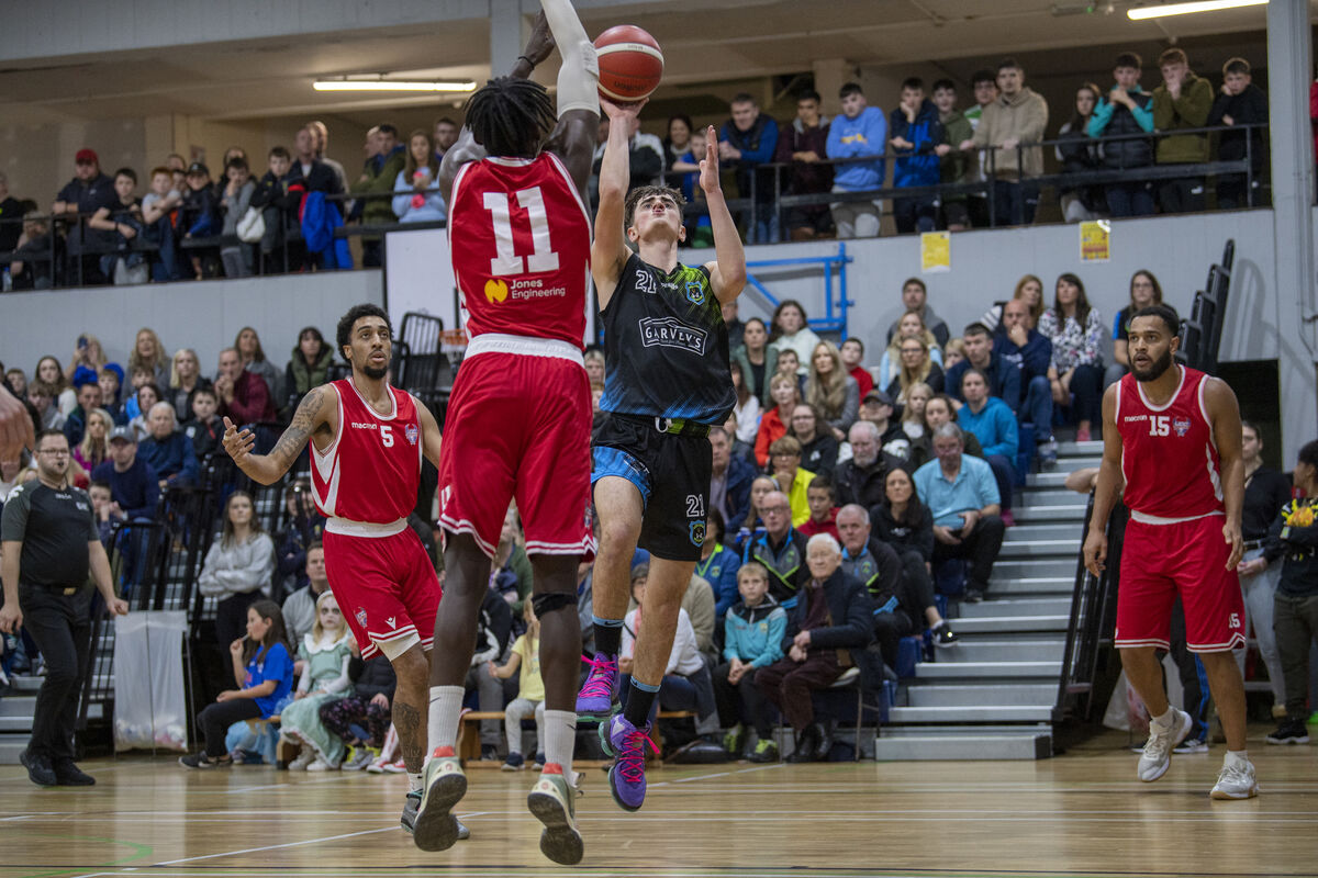 Steven Bowler, Warriors Tralee, shoots from Tala Fam Thiam, UCC Demons. Picture: Domnick Walsh Steven Bowler, Warriors Tralee, shoots from Tala Fam Thiam, UCC Demons. Picture: Domnick Walsh