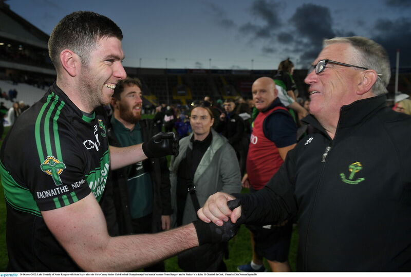 Nemo captain Luke Connolly with club legend Sean Hayes. Picture: Eóin Noonan/Sportsfile