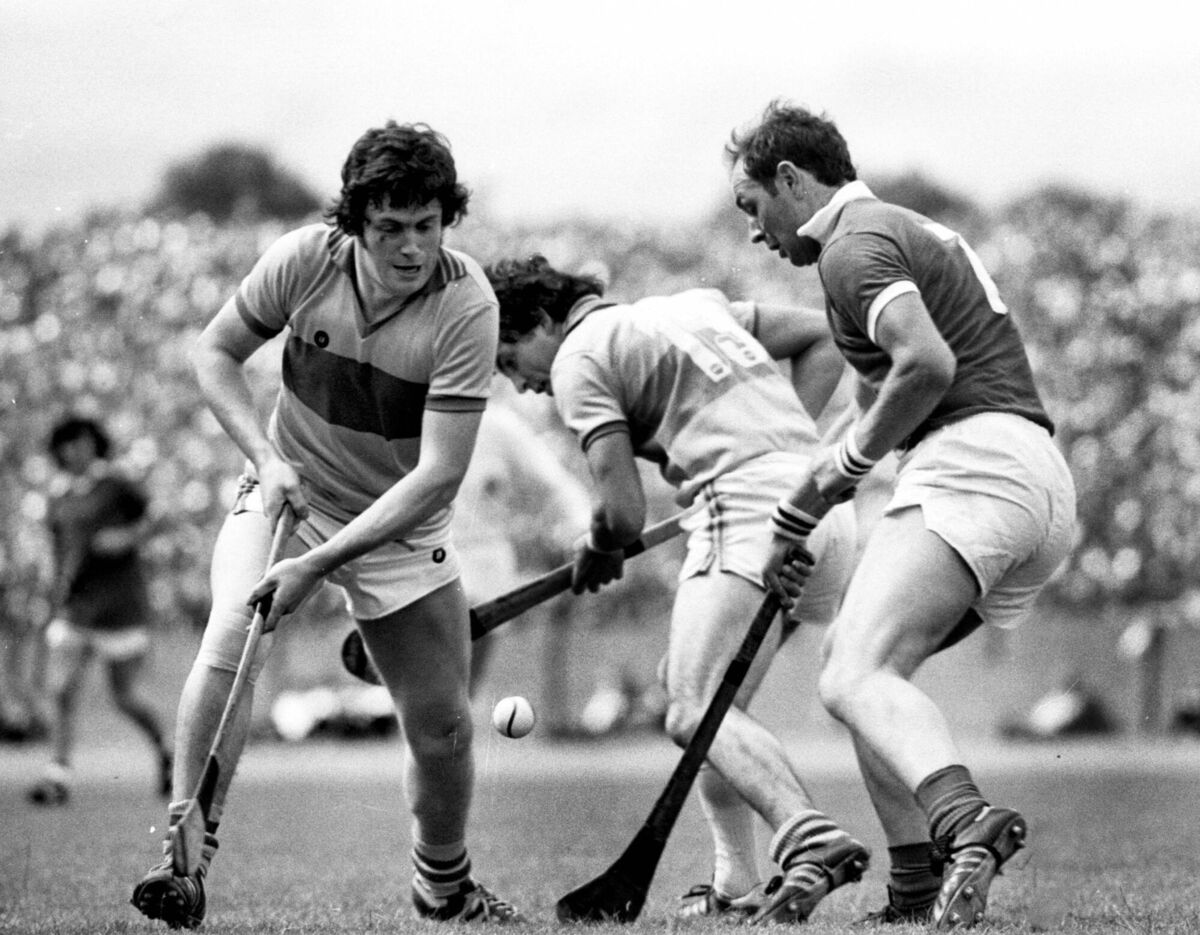 Cork half-back Denis Coughlan (right) tussles with Clare's Martin McKeogh and Pat O'Connor.