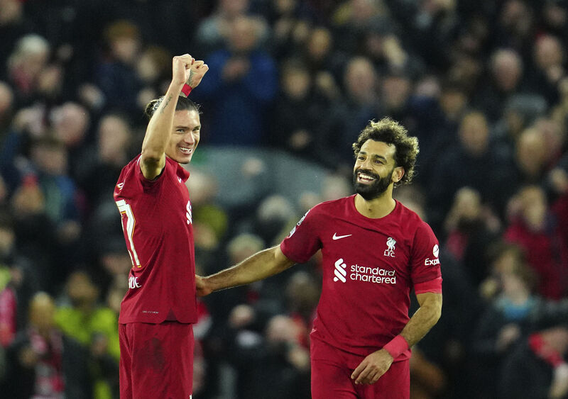 Liverpool goalscorers  Darwin Nunez, left, and Liverpool's Mohamed Salah celebrate at the end of the Champions League Group A  match against Napoli, at Anfield stadium in Liverpool, England, Picture: AP Photo/Jon Super
