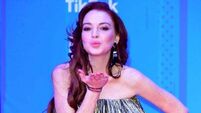 Lindsay Lohan sings Jingle Bell Rock in new music video released by Netflix