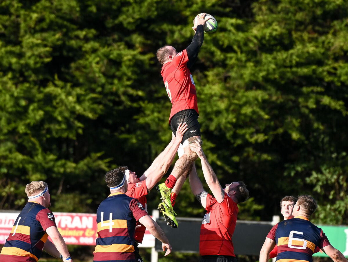 Midleton's Conor Walsh goes high to win the lineout unchallenged against Skerries. Picture: David Keane.