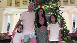 <p>Gary Philpott with wife Andrea and their children Ryder and Axel</p>