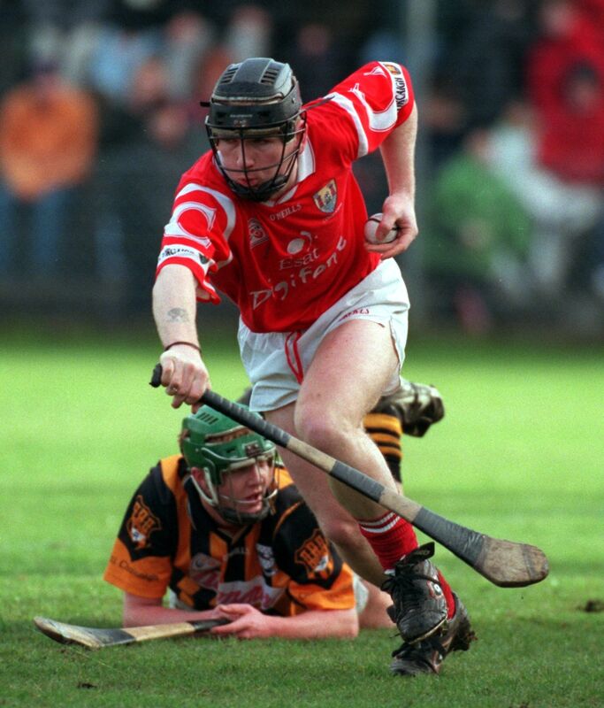 Cork's Wayne Sherlock racing away from Kilkenny's Henry Shefflin. 
