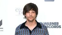 Louis Tomlinson forced to reschedule events after breaking arm in fall
