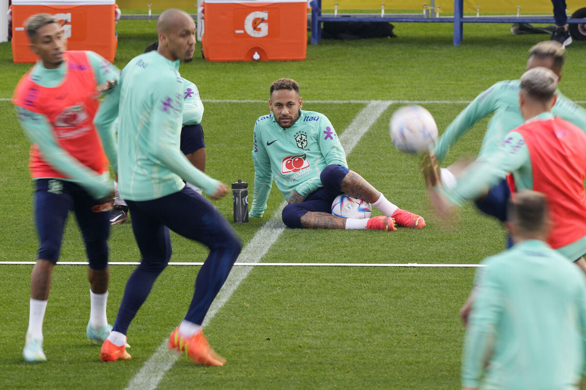 Brazil's Neymar, right, takes a break with his teammate Casemiro during a training session. Picture: AP Photo/Antonio Calanni