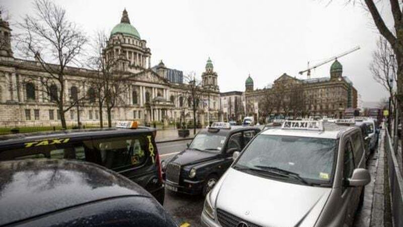Man held after Belfast taxi driver threatened with gun