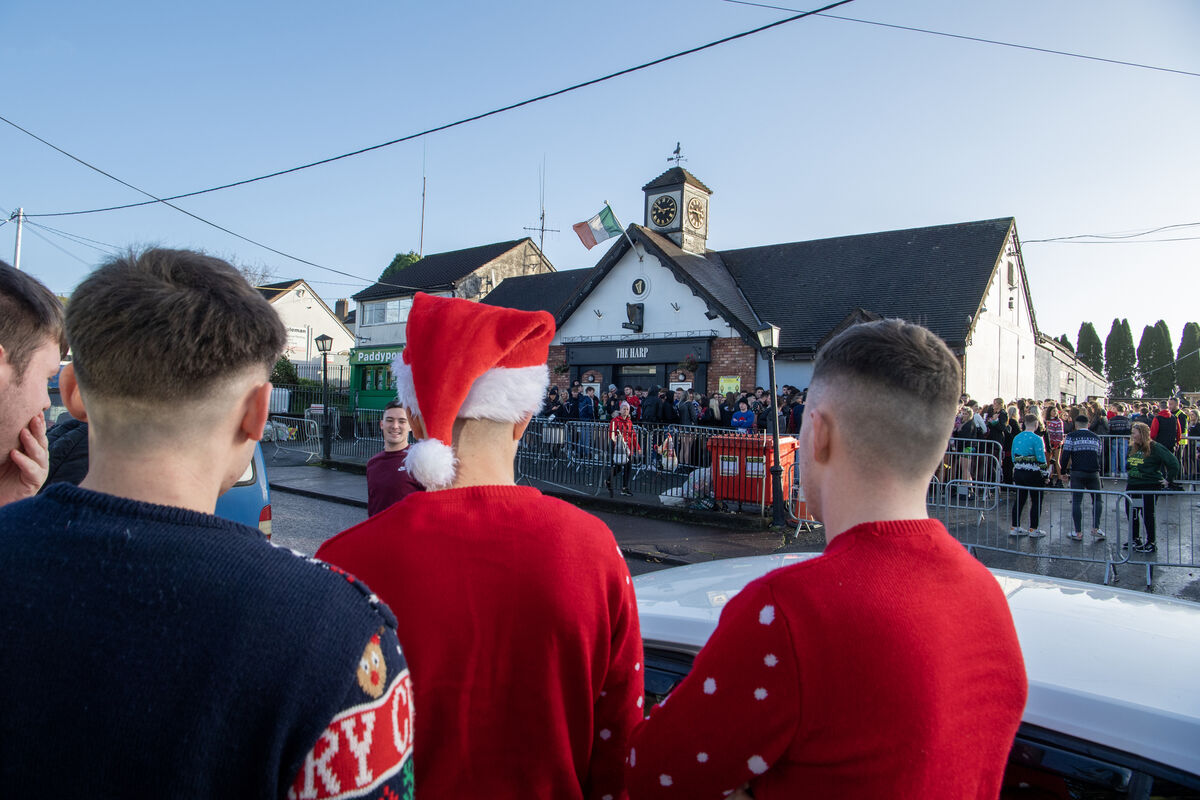 Students in an early morning queue at the Harp Bar to celebrate Christmas jumper day. Picture Dan Linehan Students in an early morning queue at the Harp Bar to celebrate Christmas jumper day. Picture Dan Linehan