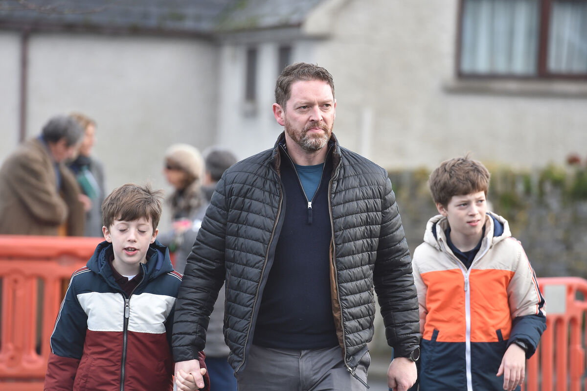  Stephen Teap with his sons Noah and Oscar at the memorial celebration for the late Vicky Phelan at the Church of the Assumption, Mooncoin, Kilkenny. Picture Dan Linehan