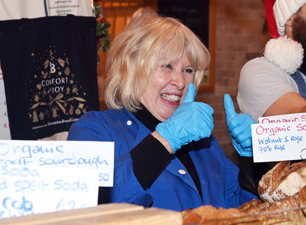 A thumbs up to well wishes from a customer from Sheila Fitzpatrick, owner of the Alternative Bread Company (ABC), which is celebrating 25 years in the English Market in Cork. Picture: Denis Minihane.