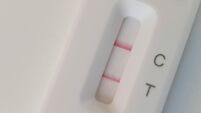 London, UK, 8 March 2022: A positive covid result on a Flow Flex lateral flow test. The government ended almost all coronavirus