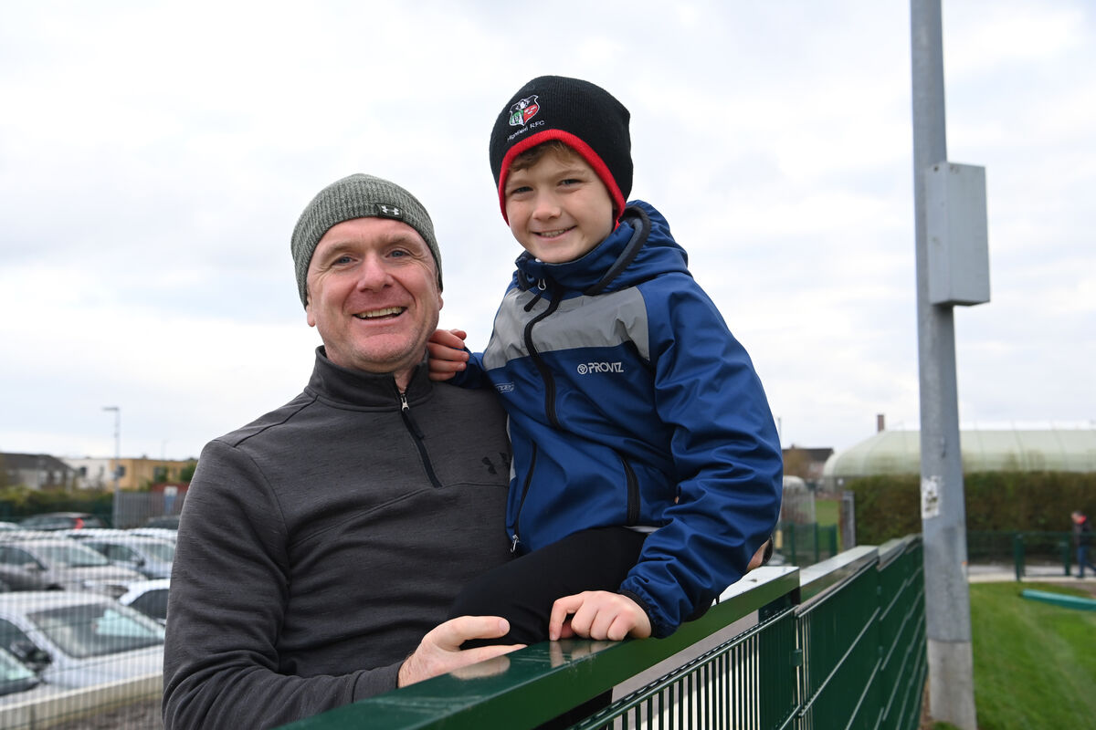 Colman and Oscar Twomey watching the Highfield v UCC match. Picture: Dan Linehan