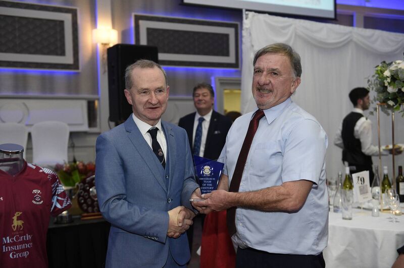 Fergus McDaid is presented with a trophy by Michael Geasley acknowledging his naming in the Team of the Century. Picture: Gavin Monaghan.