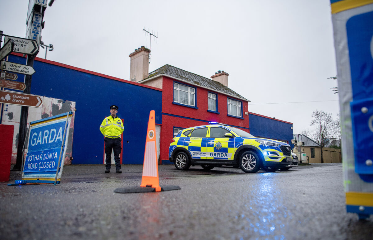  A Garda on duty in the West Cork village of Béal Átha and Ghaorthaidh where a woman was fatally injured after a car collided with pedestrians in the early hours of Tuesday morning.. Two other women were injured in the incident. Picture Dan Linehan