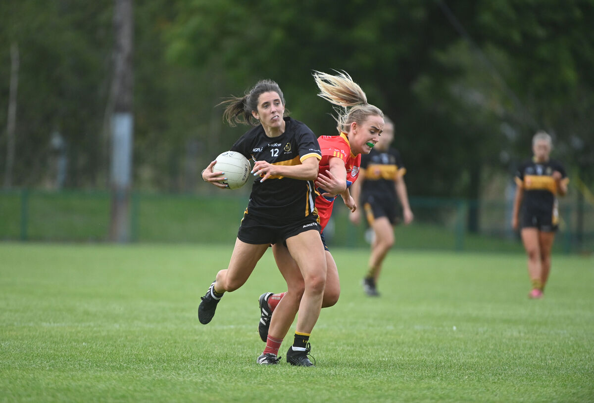  Ciara O'Sullivan, Mourneabbey, clashes in front of goal with defender Isobel Sheehan, of Éire Óg, before Mourneabbey made it eight counties in nine years at MTU Cork in October. Picture: Larry Cummins.