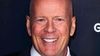 Bruce Willis cuddles puppy in first family photos since retirement due to health