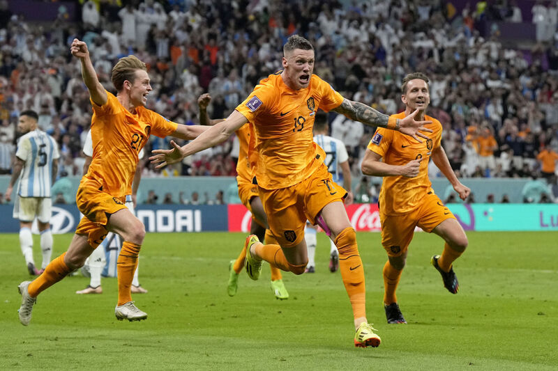 Wout Weghorst of the Netherlands, center, celebrates after scoring his side's second goal during the World Cup quarter-final against Argentina, at the Lusail Stadium in Lusail, Qatar. Picture: AP Photo/Ricardo Mazalan