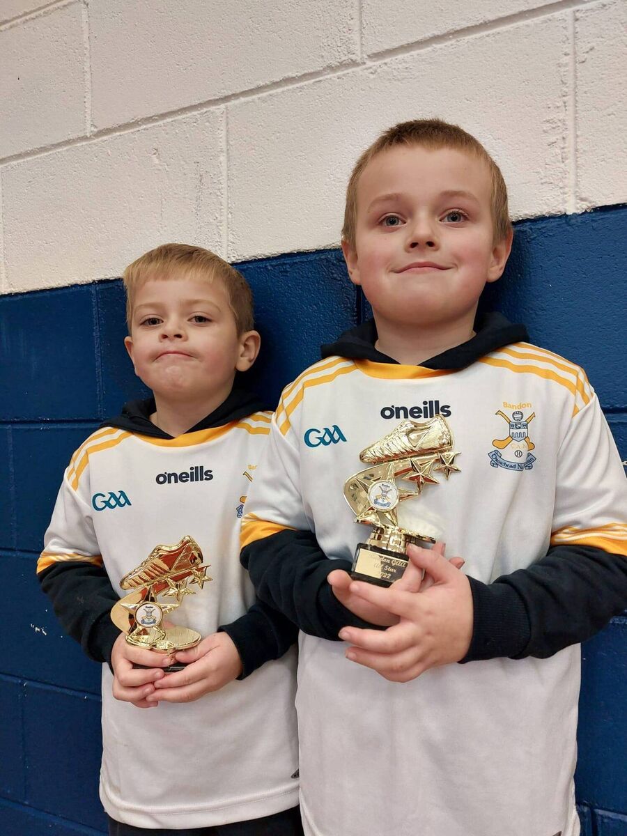 Scott and Daragh Walsh with their trophies and Bandon GAA jerseys after completing the recent camp. 