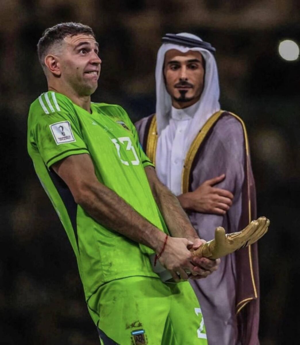 Hand of Gonad: Emiliano Martinez gets a stern look from a Qatari official.