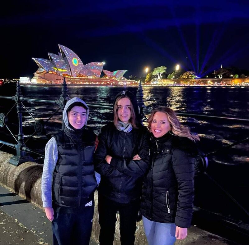 Lisa and her boys with Sydney Opera House in the background. Lisa and her boys with Sydney Opera House in the background.