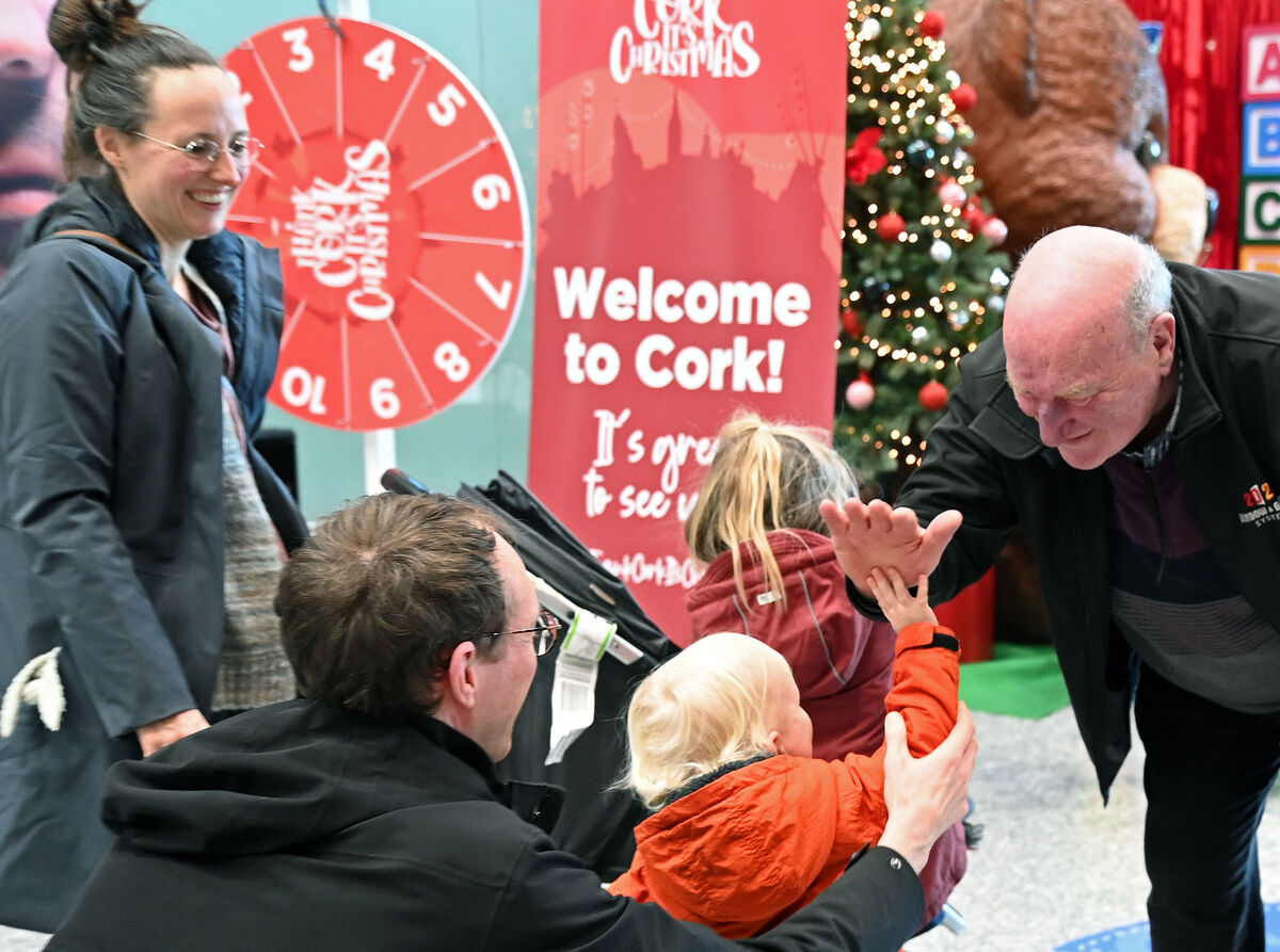Donal Garvey, Killumney, greeting his son Colm with his wife Melissa and their children Lia, James and Maeve as he got a high five from James on arrival at Cork Airport from Delft for Christmas. Picture Denis Minihane. Donal Garvey, Killumney, greeting his son Colm with his wife Melissa and their children Lia, James and Maeve as he got a high five from James on arrival at Cork Airport from Delft for Christmas. Picture Denis Minihane.