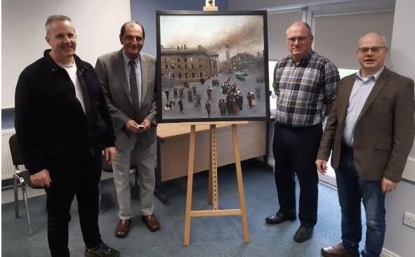 Artist George Frost (second from left) donating his painting "The 1916 Rising" to Rory O'Dwyer, Gabriel Doherty and Mervyn O'Driscoll in the History Department, UCC. 
