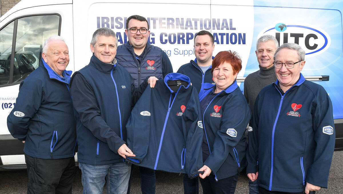  David Heffernan of Irish International Trading Corporation, making the presentation to Majella Carroll of Cork City First Responders and her colleagues, from left, Fred Lotty, Barry O'Donoghue, Alan Barry, Marty Crowley and Joe Moroney, at Colaiste Eamann Ris, Turner's Cross. Picture: David Keane.