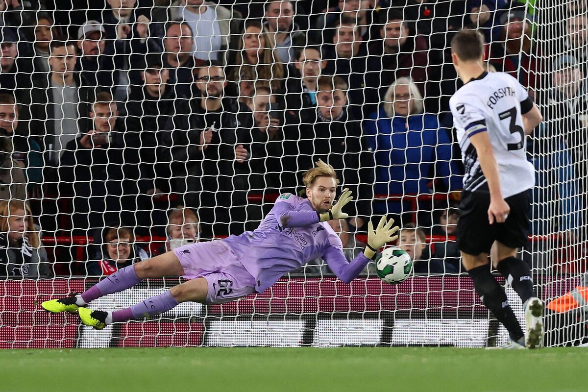 RECORD-BREAKER: Caoimhin Kelleher of Liverpool saves a penalty taken by Craig Forsyth. Picture: Nathan Stirk/Getty Images RECORD-BREAKER: Caoimhin Kelleher of Liverpool saves a penalty taken by Craig Forsyth. Picture: Nathan Stirk/Getty Images