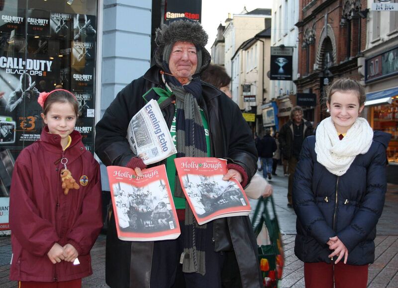 Miriam Collins (right) and Niamh Crowley with news vendor Michael O'Regan. Photo was taken as part of the girls' history project. Miriam Collins (right) and Niamh Crowley with news vendor Michael O'Regan. Photo was taken as part of the girls' history project.