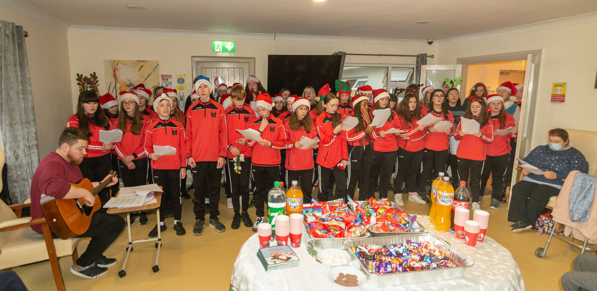 First, second, and fifth year students from St Peter's Community School, Passage West, singing Christmas carols to residents and staff of Padre Pio Nursing Home in Rochestown. Picture: Cian O'Regan.