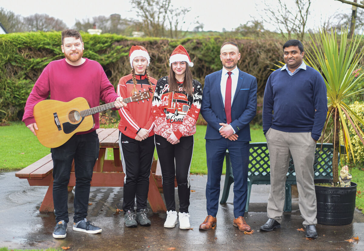 (Left-Right): Alan Murphy, teacher, St Peter's Community School, Passage West, students Jule Widmann and Simone Jennings, Principal, Tony McSweeney, and Director of Nursing at Padre Pio Nursing Home, Arun Unnithan, during the visit of St Peter's Community School to Padre Pio Nursing Home in Rochestown. Picture: Cian O'Regan.