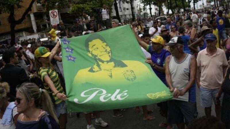 Pele’s coffin arrives at cemetery in city he made famous