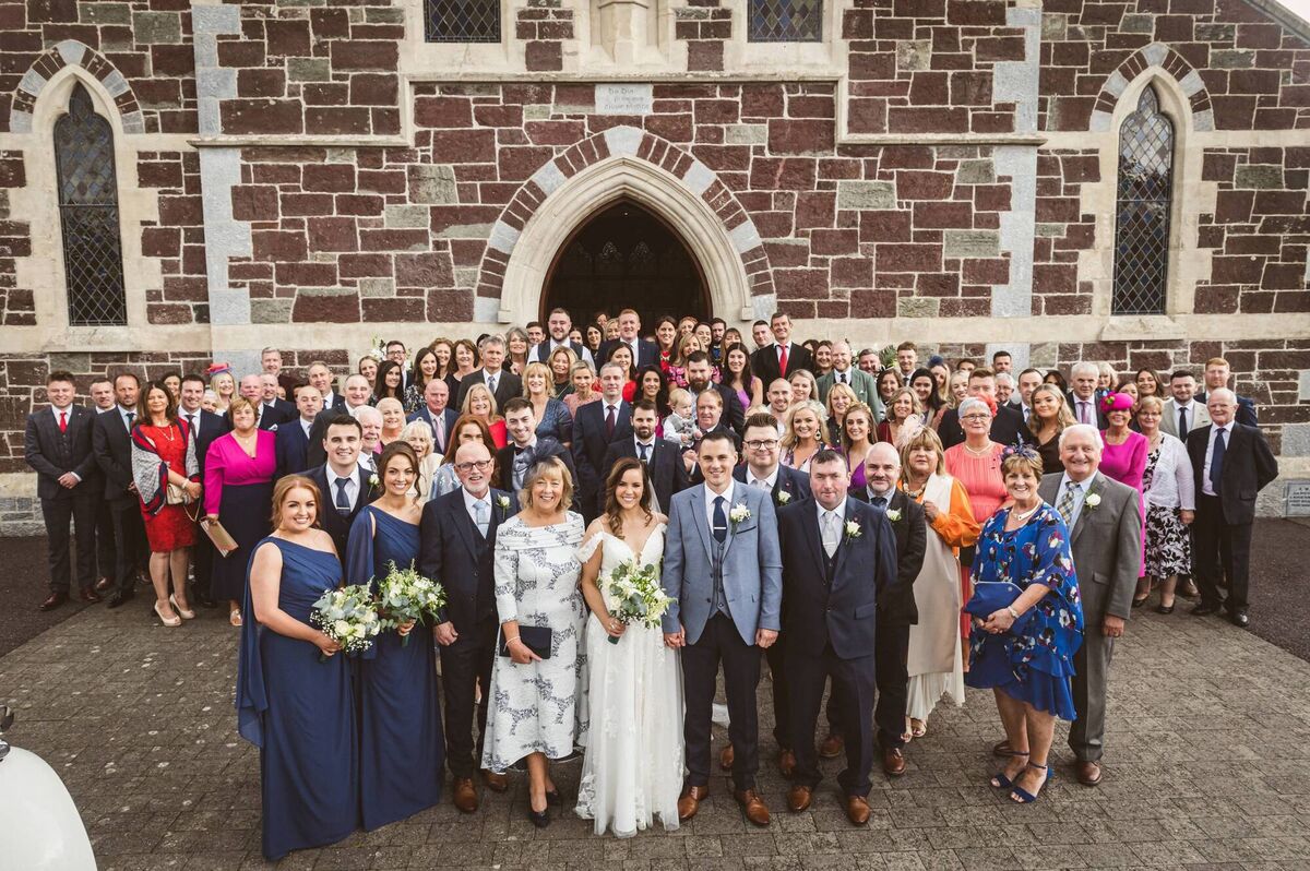 The couple with their wedding guests outside St Mary's in Carrigtwohill.