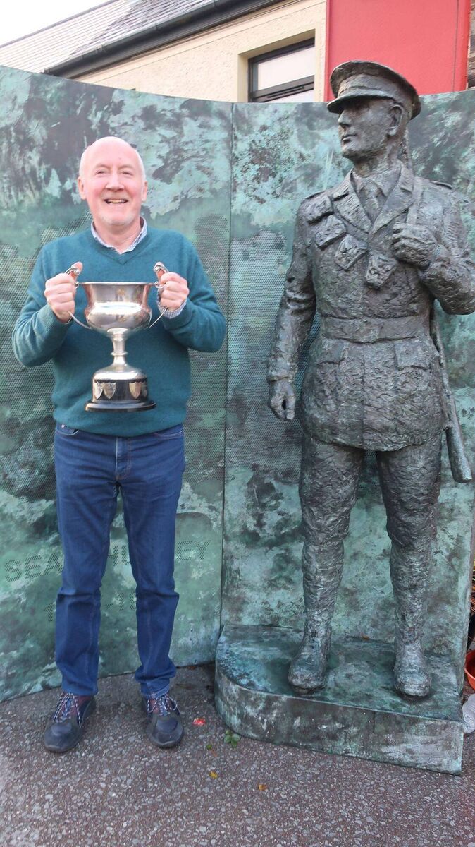Kevin Quirke pictured at the Seán Hurley monument in Drinagh with the Tom Barry Cup. Kevin was a key player on the Drinagh/Lisbealad team in 1970. Kevin Quirke pictured at the Seán Hurley monument in Drinagh with the Tom Barry Cup. Kevin was a key player on the Drinagh/Lisbealad team in 1970.