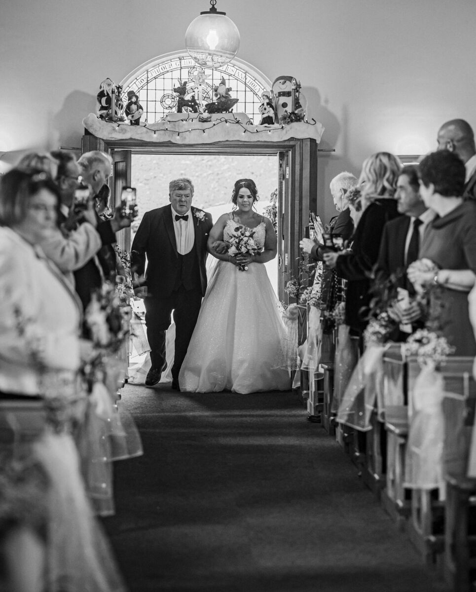 Bride Aine walking up the aisle.