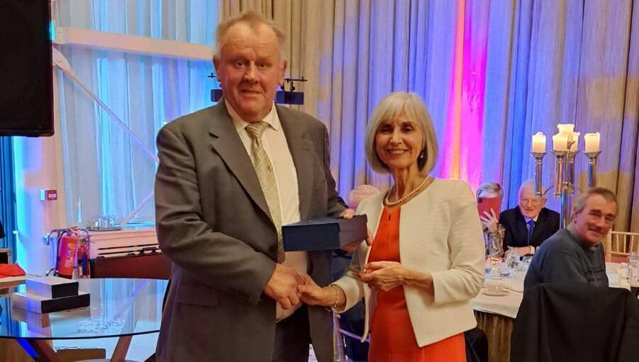 Willie Walsh, the 2022 Castlemartyr Frank McLellan Memorial Club Person of the Year winner, being presented with his award by Trudy Daly.