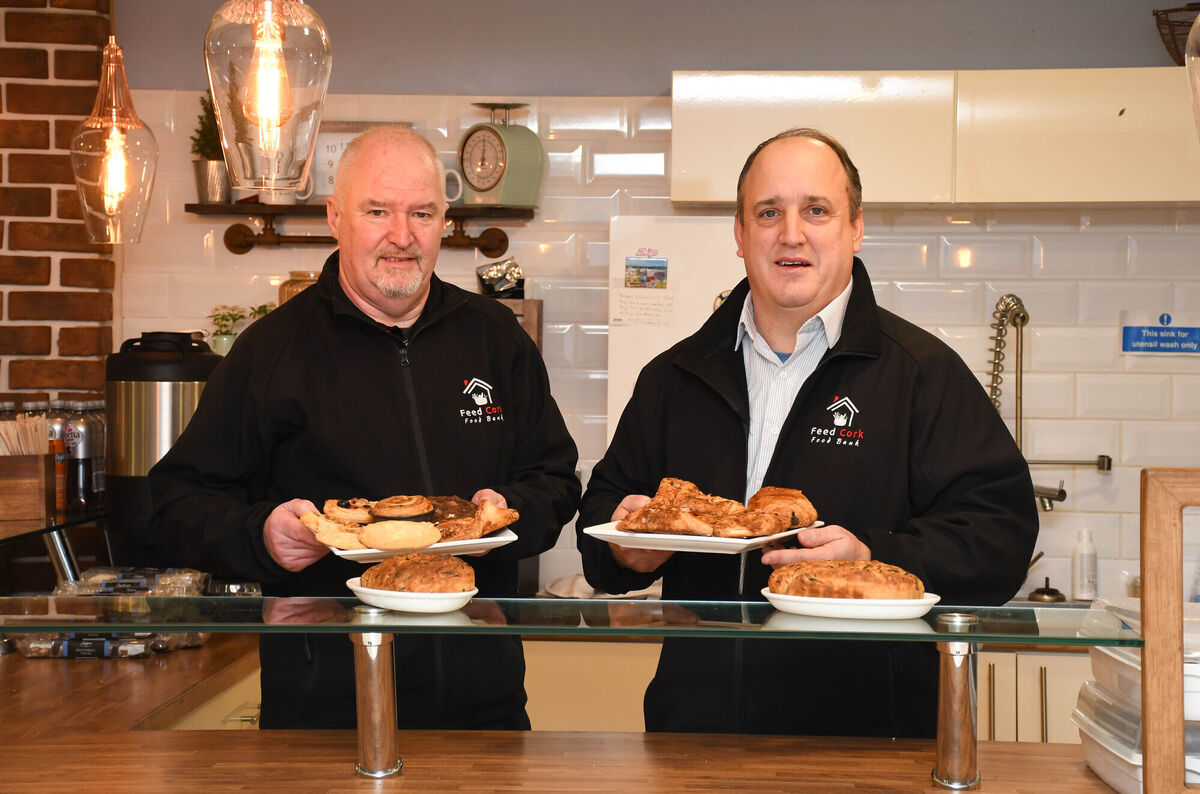 Volunteer Liam Fitzgerald and Director Hamp Sirman pictured with some of the cakes and biscuits available at the cafe in Feed Cork at Cork Church, Lower Oliver Plunkett Street. Picture: Howard Crowdy