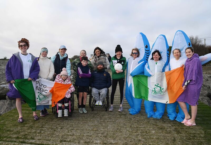 Teresa Dineen, chairperson, Irish Wheelchair Rugby, Orla O'Brien and Olivia Keating of Rebel Wheelers, in shark suits, with some other participants in a charity swim in aid of Irish Wheelchair Rugby at Fountainstown, Co. Cork, photographed with supporters, family and friends of Irish Wheelchair Rugby. Teresa Dineen, chairperson, Irish Wheelchair Rugby, Orla O'Brien and Olivia Keating of Rebel Wheelers, in shark suits, with some other participants in a charity swim in aid of Irish Wheelchair Rugby at Fountainstown, Co. Cork, photographed with supporters, family and friends of Irish Wheelchair Rugby.