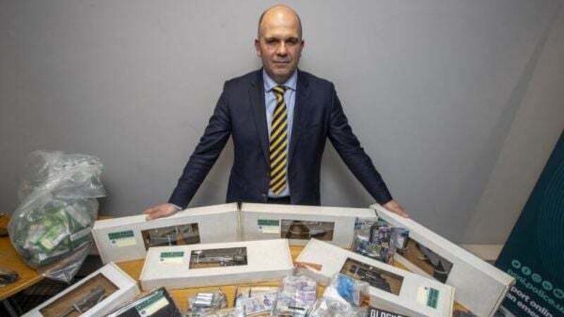 Guns and swords seized in operation targeting organised crime gang