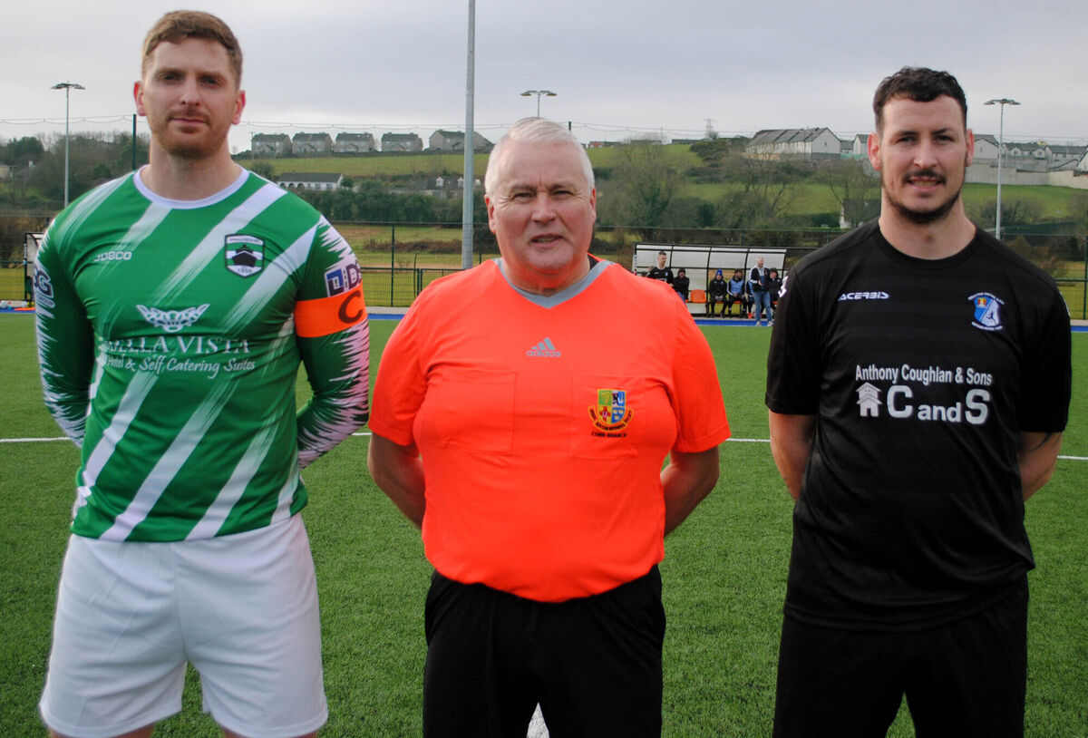 Springfield's captain Ross O'Donovan Wyatt (left) with Grattan United's Anthony Byrne, accompanied by referee Jim Hennessy. Picture: Barry Peelo.