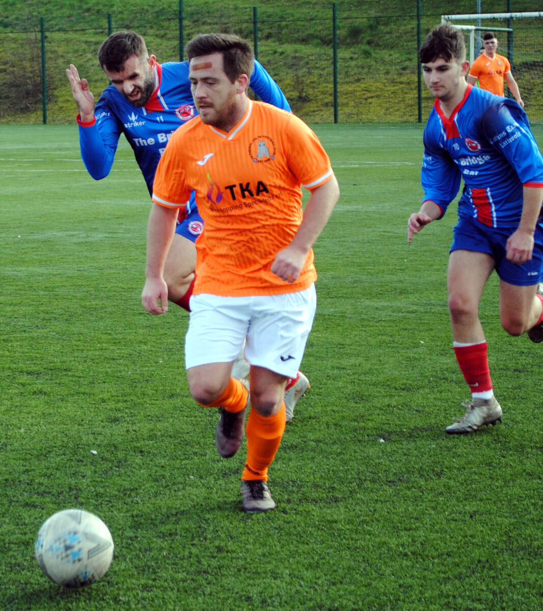 Cathedral's Derek Heaphy comes away with possession in the action against Rathcoole. Picture: Barry Peelo.