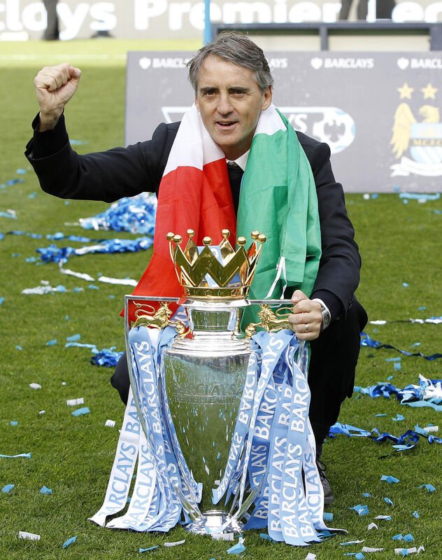 2012 picture of Manchester City manager Roberto Mancini celebrating with the Premier League trophy. Mancini was the club manager between December 2009 and May 2013. A crucial time in the Premier League's investigation of the club finances. Picture:  Peter Byrne/PA Wire.