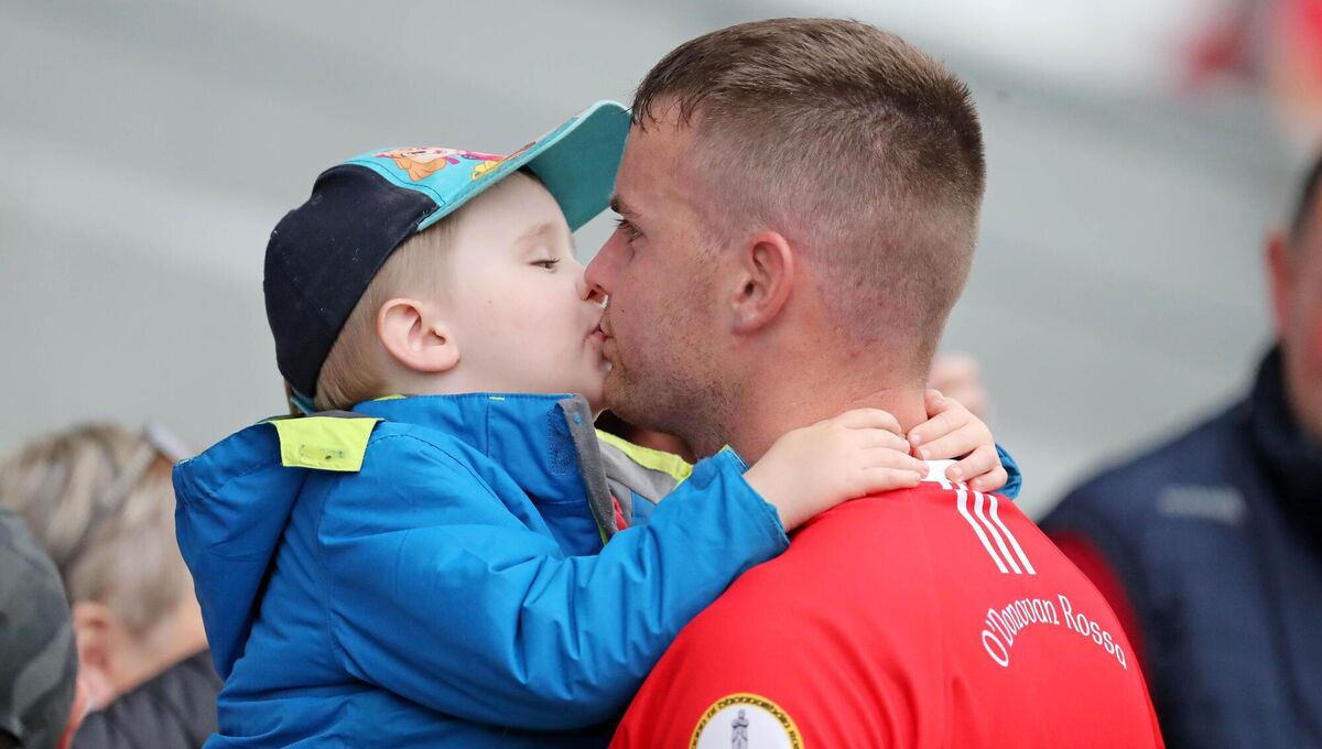 Three-year-old, Charlie Crowley, consoles his dad Paudie Crowley. Picture: Jim Coughlan