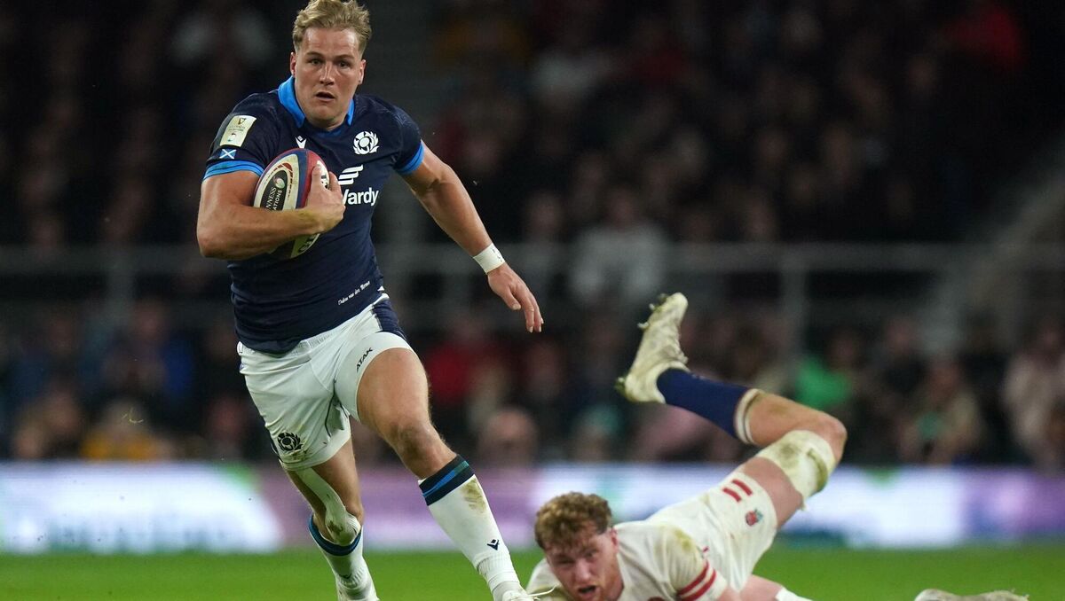 Scotland's Duhan van der Merwe beats England's Oliver Chessum on the way to scoring. Scotland's Duhan van der Merwe beats England's Oliver Chessum on the way to scoring.