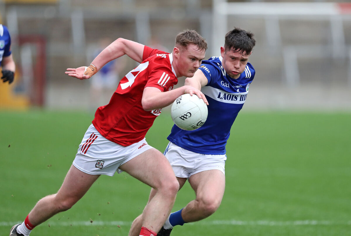  Conor Daly, Cork, runs at Sean McGrath, Laois. Picture: Jim Coughlan.